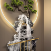 Angled detail showing the depth of the relief, the bonsai branches and the glowing gold ring